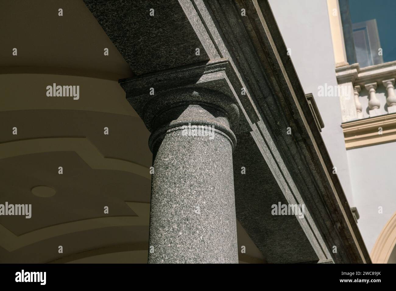 column with neoclassical capital. construction detail of a granite colonnade. particular architecture building Stock Photo