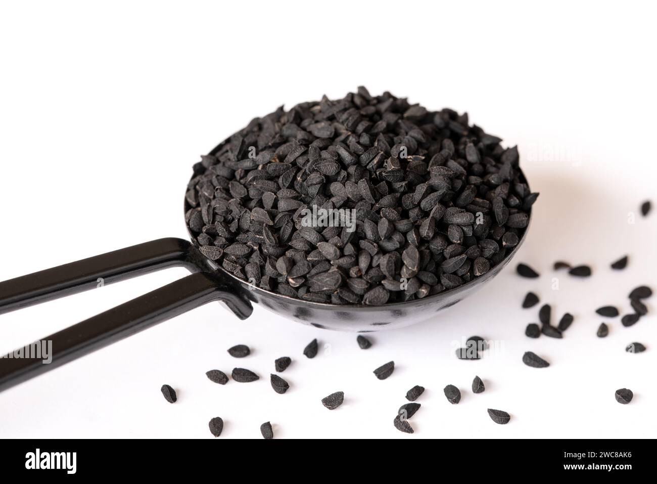 Charnushka Seeds in a Spoon Stock Photo