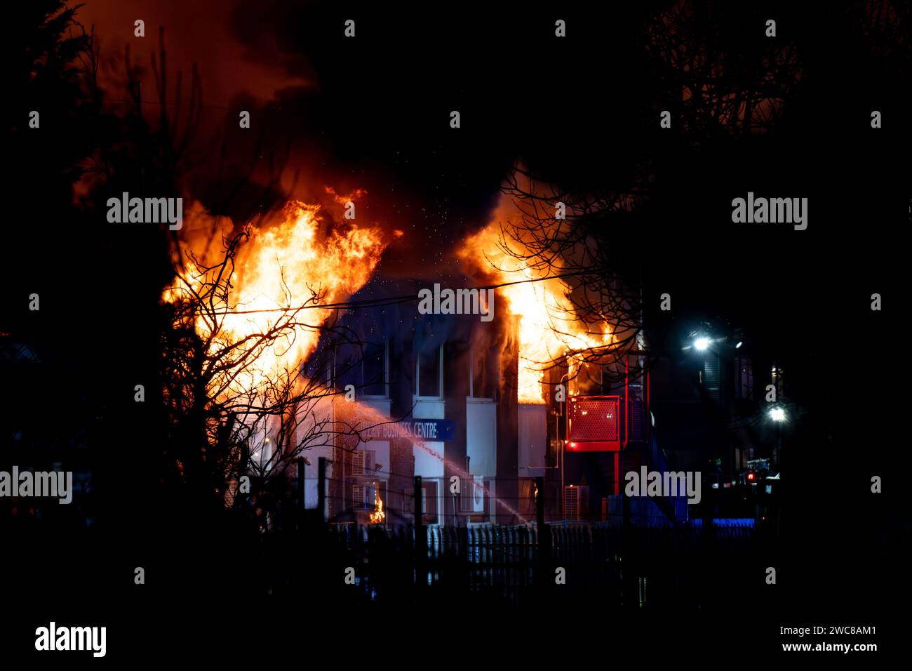 Newport, UK. 14th January 2024.   Firefighters battle to put the fire out at the Wern Industrial Estate in Rogerstone in Wales on 14th January 2024.   This image may only be used for Editorial purposes. Editorial use only.  Credit: Ashley Crowden/Alamy Live News Stock Photo