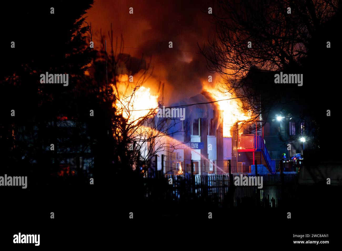 Newport, UK. 14th January 2024.   Firefighters battle to put the fire out at the Wern Industrial Estate in Rogerstone in Wales on 14th January 2024.   This image may only be used for Editorial purposes. Editorial use only.  Credit: Ashley Crowden/Alamy Live News Stock Photo