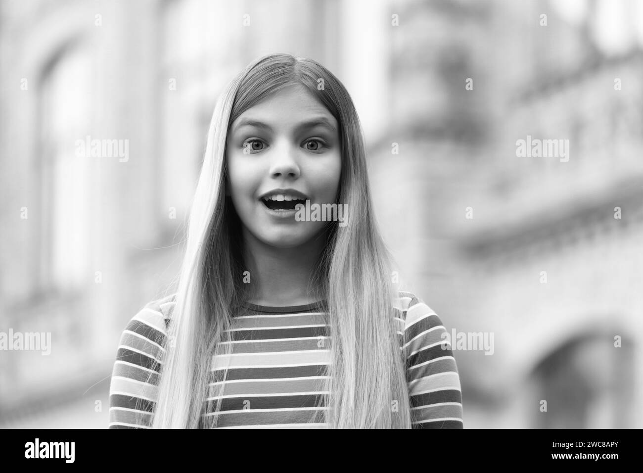 portrait photo of amazed teen girl outside. portrait of teen girl. portrait of teen girl Stock Photo