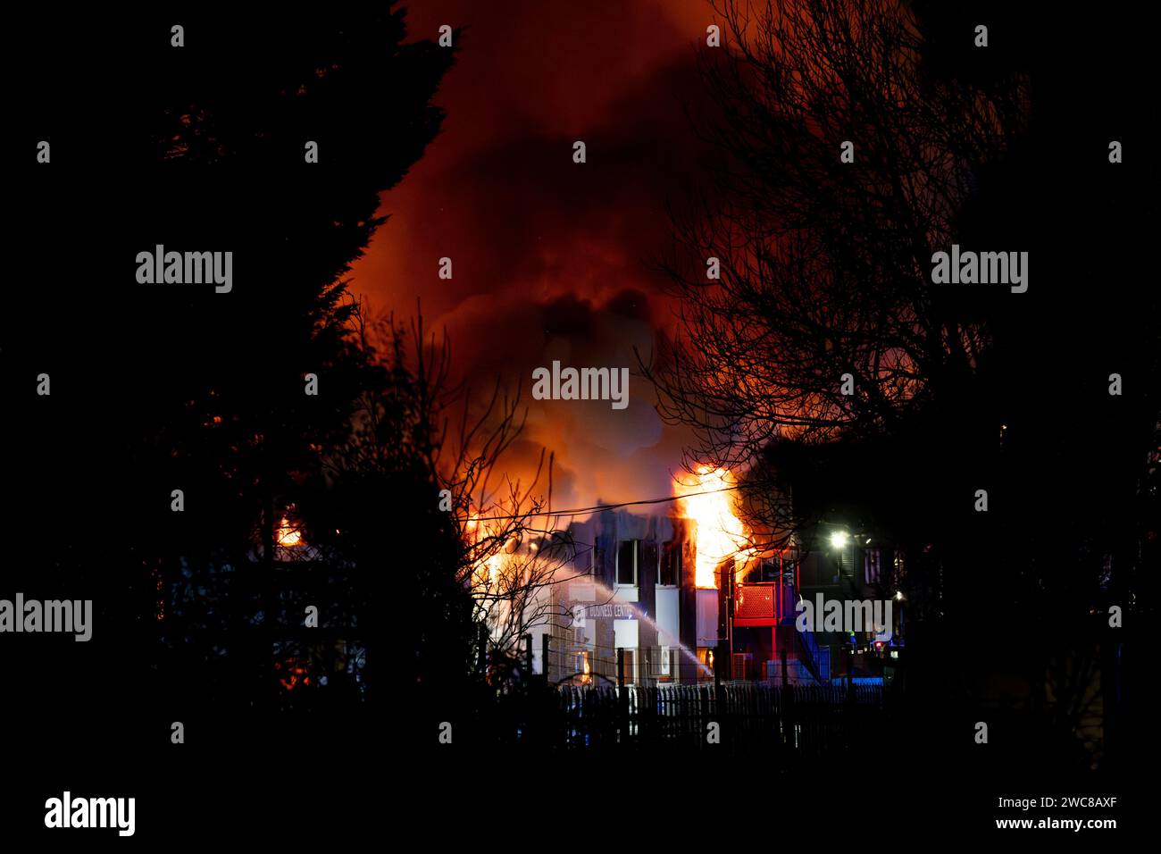 Newport, UK. 14th January 2024.   Firefighters battle to put the fire out at the Wern Industrial Estate in Rogerstone in Wales on 14th January 2024.   This image may only be used for Editorial purposes. Editorial use only.  Credit: Ashley Crowden/Alamy Live News Stock Photo