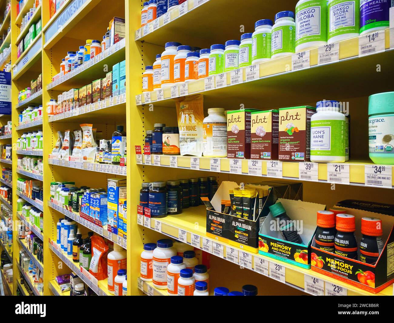 Vitamin bottles on shelves at a vitamin store Stock Photo - Alamy