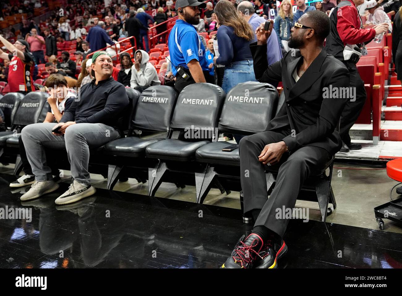 Former Miami Heat Player Dwyane Wade, Right, Takes Photos Before An NBA ...