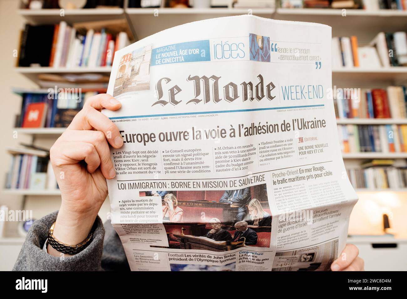 Frankfurt, Germany Dec 20, 2023 A woman reads Le Monde newspaper in