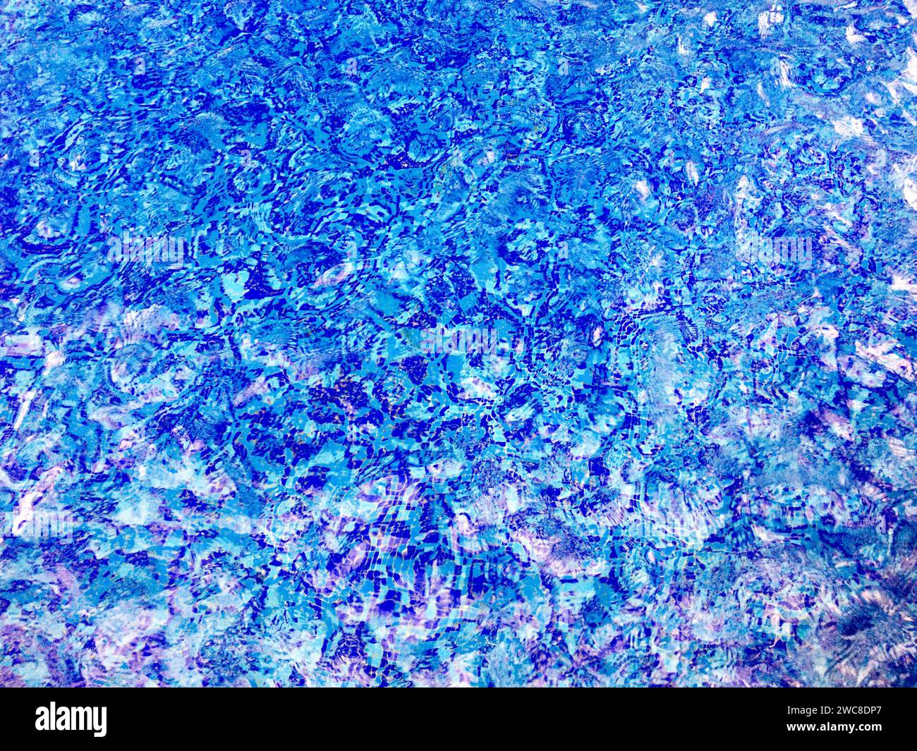 The abstract beauty of clean and clear water in a sparkling pool ...