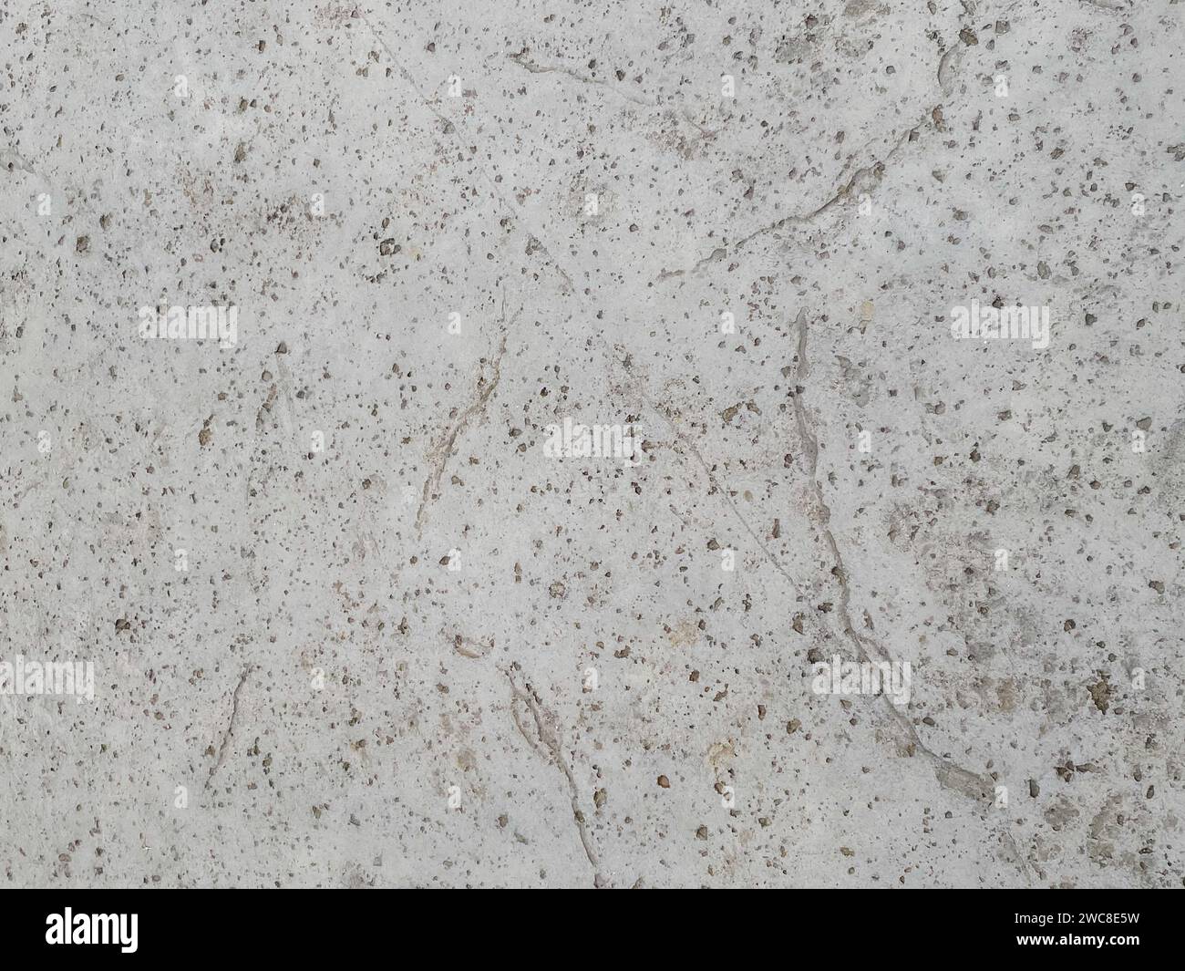 Dark concrete texture with a crumpled paper backdrop Stock Photo