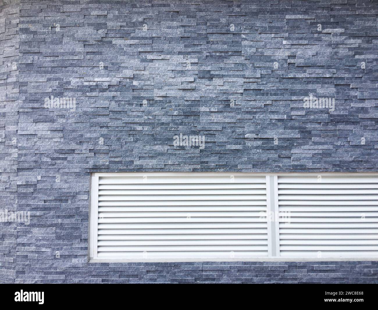 Dark concrete texture with a crumpled paper backdrop Stock Photo