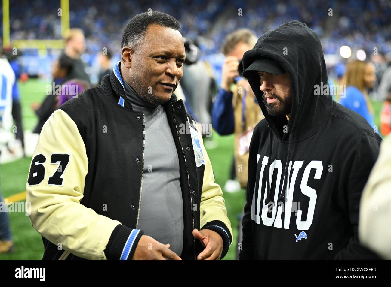 Detroit, USA. 14th Jan, 2024. DETROIT, MI - JANUARY 14: Barry Sanders and Eminem talk prior to the game between Los Angeles Rams and Detroit Lions on January 14, 2024 at Ford Field in Detroit, MI (Photo by Allan Dranberg/CSM) (Credit Image: © Allan Dranberg/Cal Sport Media) Credit: Cal Sport Media/Alamy Live News Stock Photo