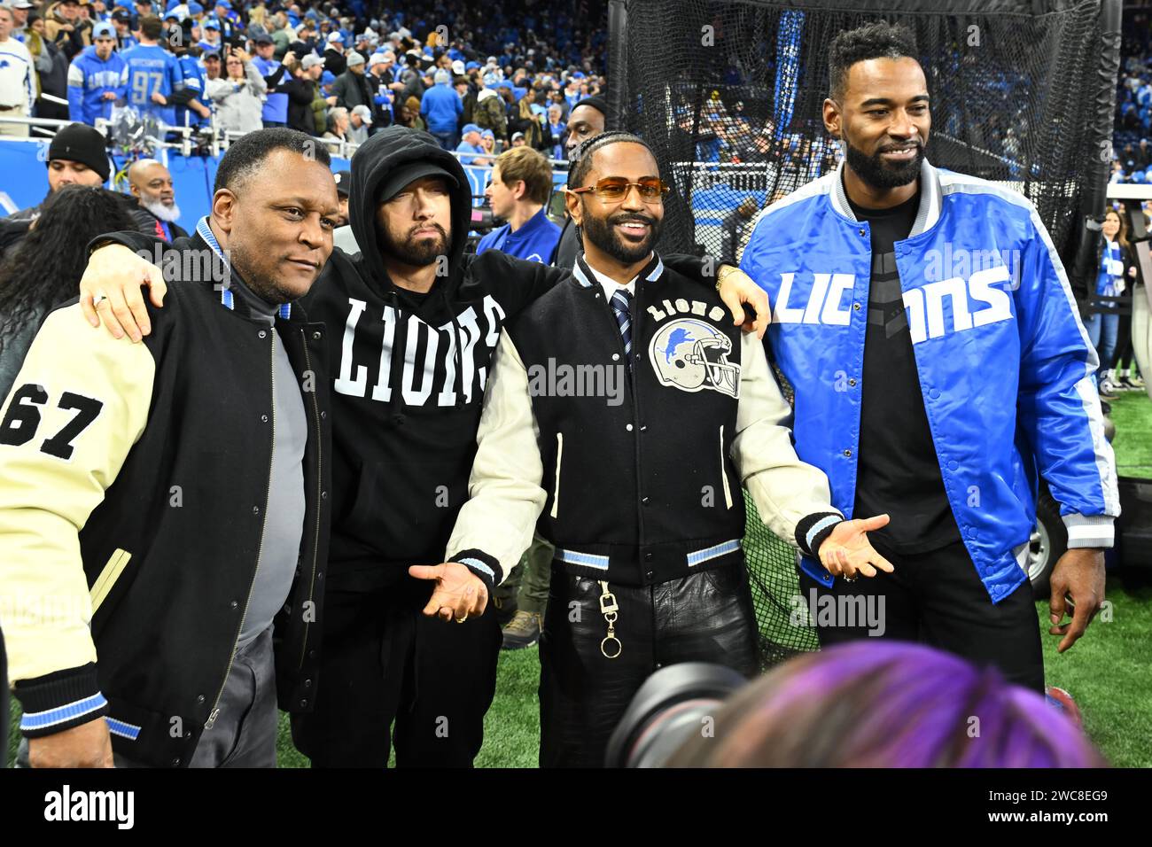 Detroit, USA. 14th Jan, 2024. DETROIT, MI - JANUARY 14: Former Lions Barry Sanders and Calvin Johnson take a photo with Big Sean and Eminem before the game between Los Angeles Rams and Detroit Lions on January 14, 2024 at Ford Field in Detroit, MI (Photo by Allan Dranberg/CSM) Credit: Cal Sport Media/Alamy Live News Stock Photo
