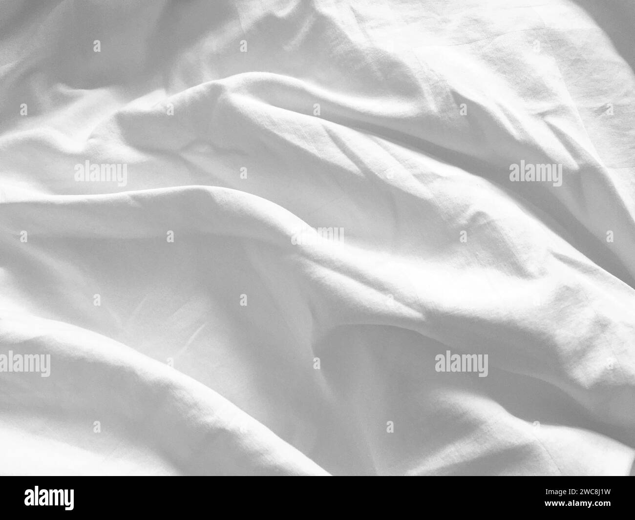 The line and pattern of this silky, white fabric create a visually appealing texture, enhancing the overall aesthetic and providing a sense of sophist Stock Photo