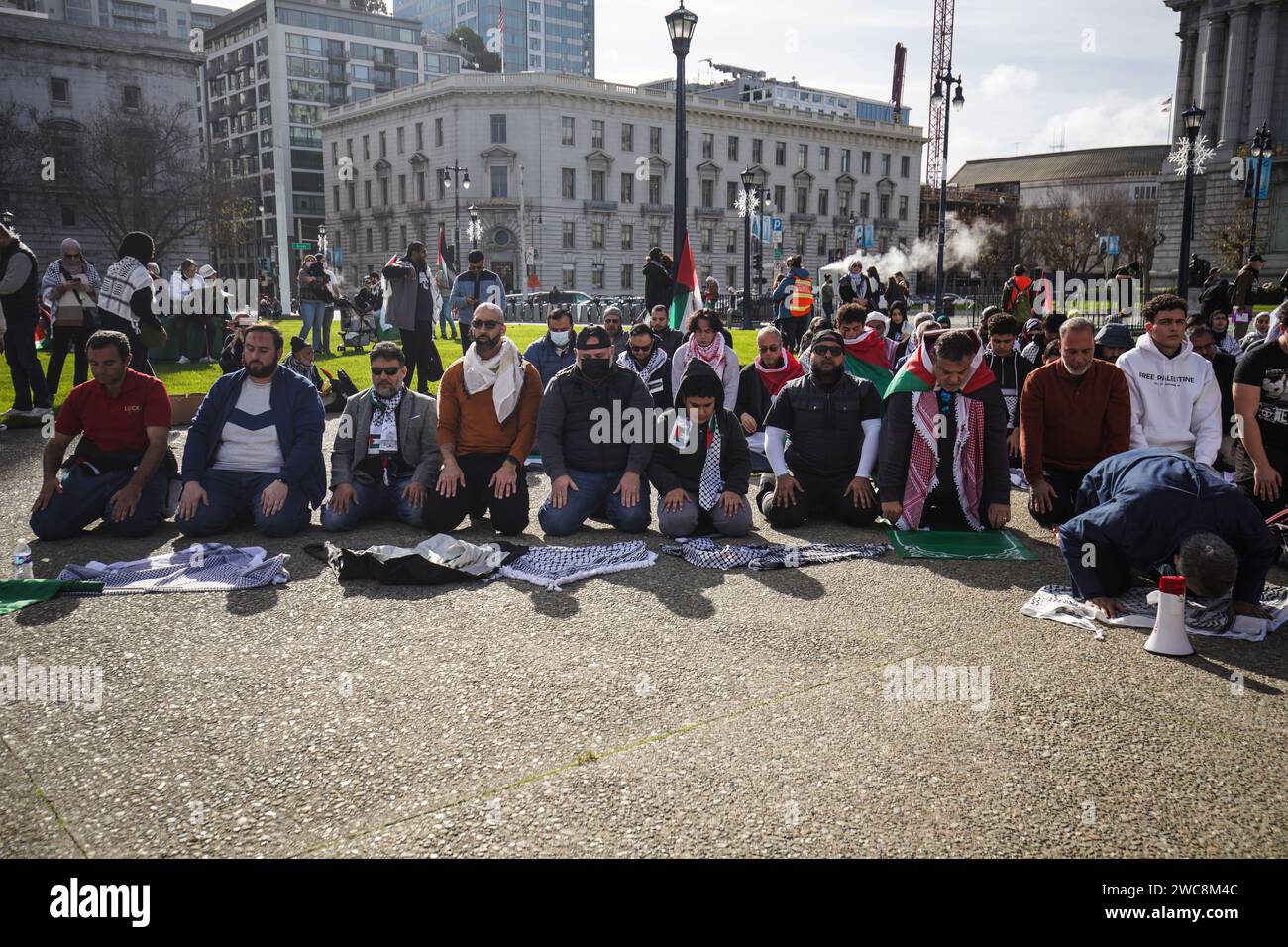 San Francisco United States 14th Jan 2024 Protesters Pray During   San Francisco United States 14th Jan 2024 Protesters Pray During The Demonstration Outside The City Hall A Pro Palestine Protest Took Place In San Francisco Drawing Thousands Of Demonstrators Outside The City Hall The Participants Call For A Cease Fire From Israel To The Gaza Area Expressing Their Solidarity The Protest Transforms Into A March As Thousands Of Demonstrators Chanting Slogans And Brandishing Placards Banners And Flags Move From The City Hall To The Downtown Area Photo By Michael Ho Wai Leesopa Imagessipa Usa Credit Sipa Usaalamy Live News 2WC8M4C 