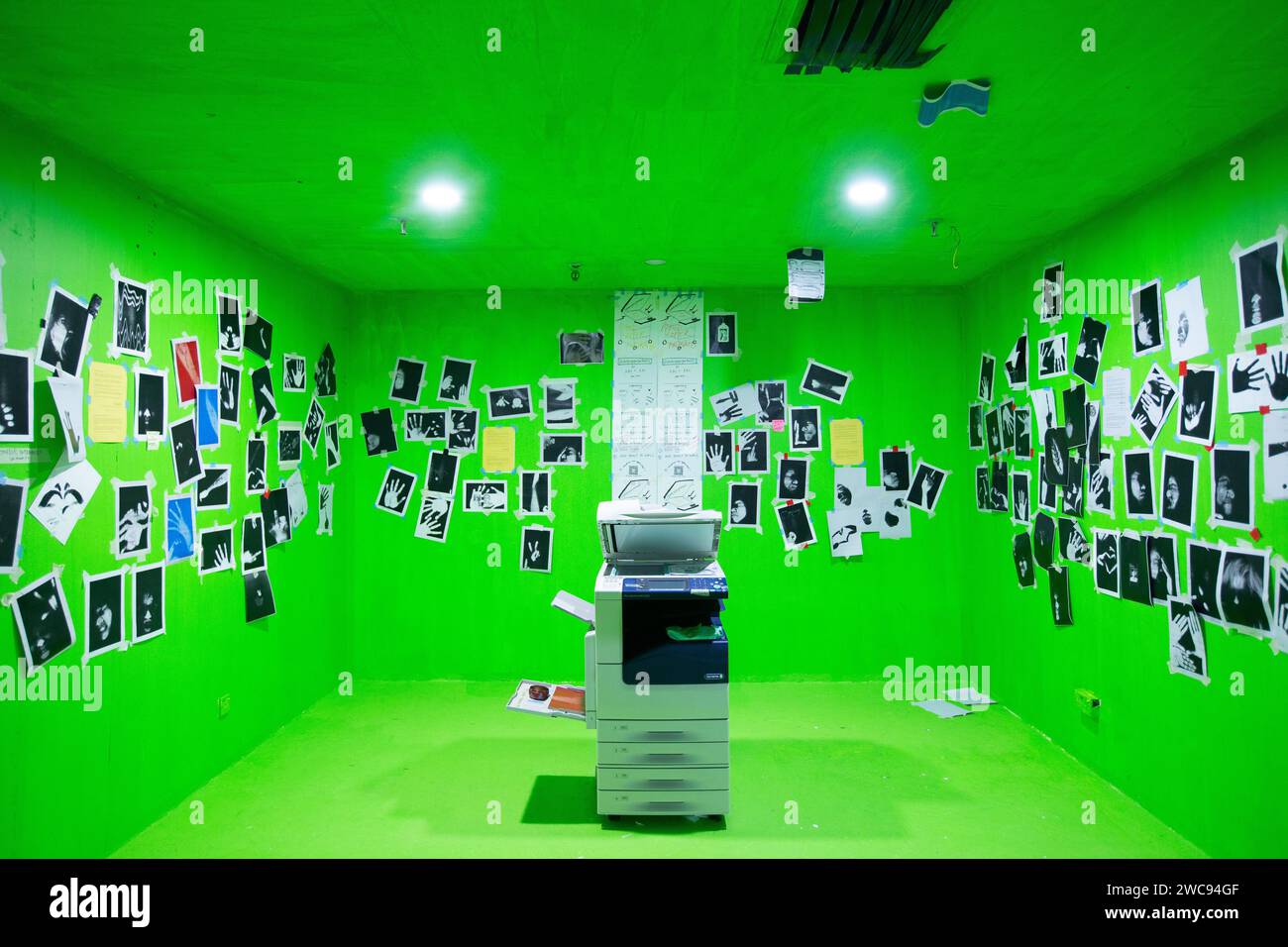 Retail space transformed into a green room with one photocopier machine place in the centre for the public to print picture of themselves on it. Stock Photo