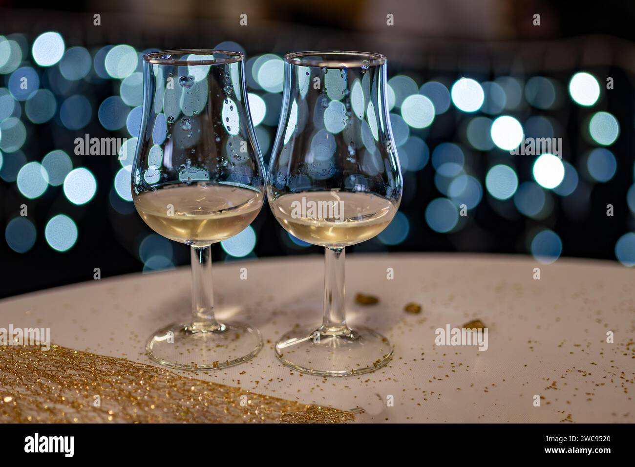 Small tasting glasses of sparkling wine champagne on winter festival in December, Avenue de Champagne, Epernay, Champagne region, France Stock Photo