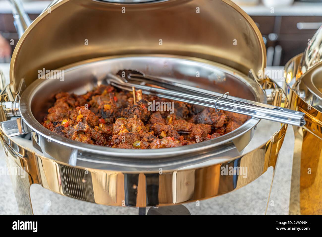 Stewed Beef In Chaffing Dish at aNigerian Party Stock Photo