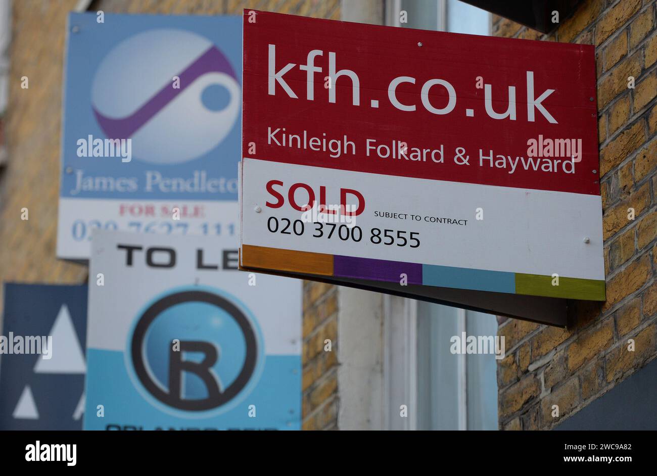 File photo dated 16/12/14 of estate agent's boards in Clapham, London