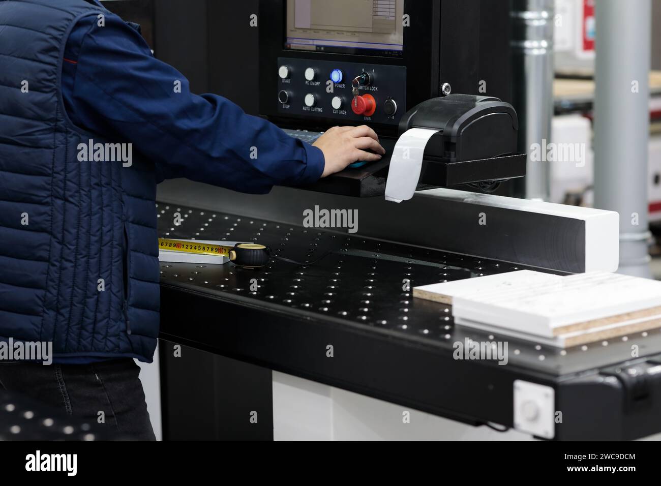 Factory worker labeling barcode shipping stickers. Thermal barcode