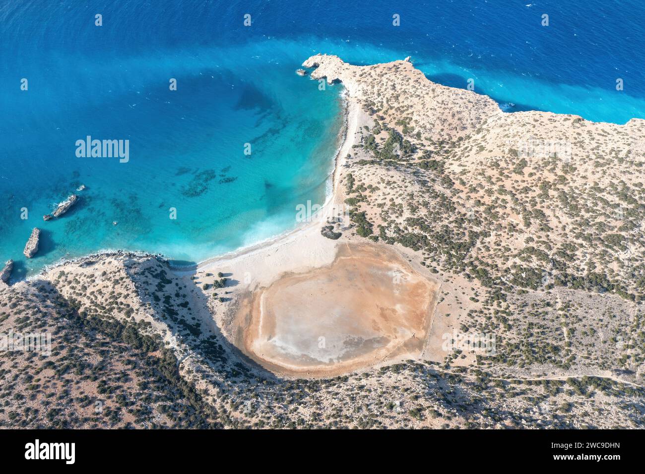Cape Tripiti at Gavdos southernmost Greek island, Crete. Aerial drone view of beach, wild landscape, vast clear turquoise ripple Libyan sea water. Stock Photo
