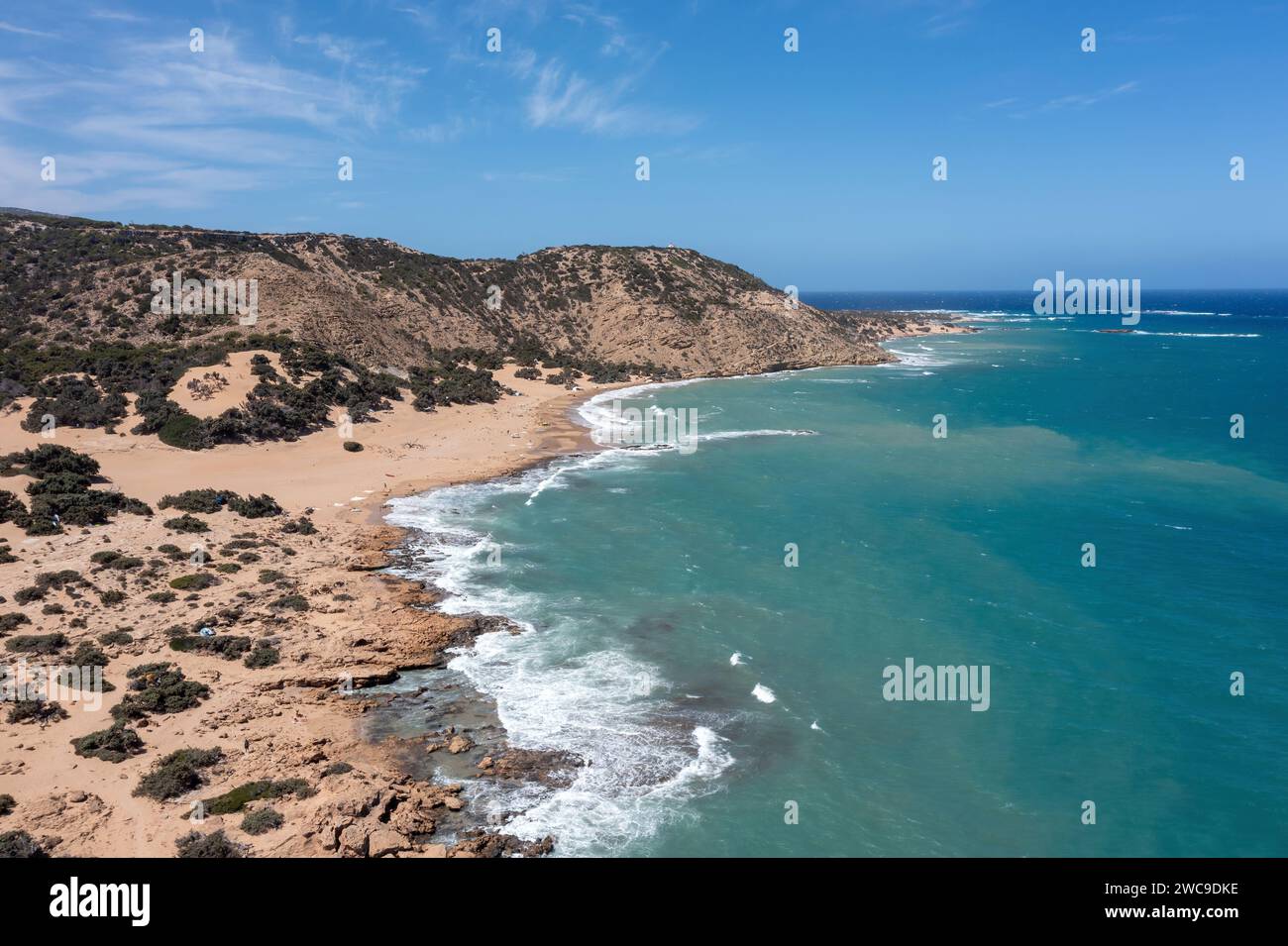 Crete, Greece, Gavdos island. Aerial drone view of beach, wild landscape, ripple sea water, blue sky, nature. Adventure, hiking, sport. Stock Photo