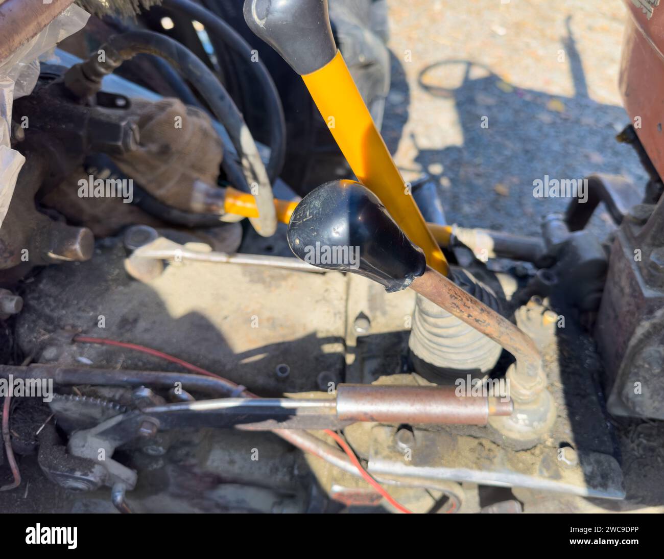 Old tractor metal hand brake and gear levers Stock Photo