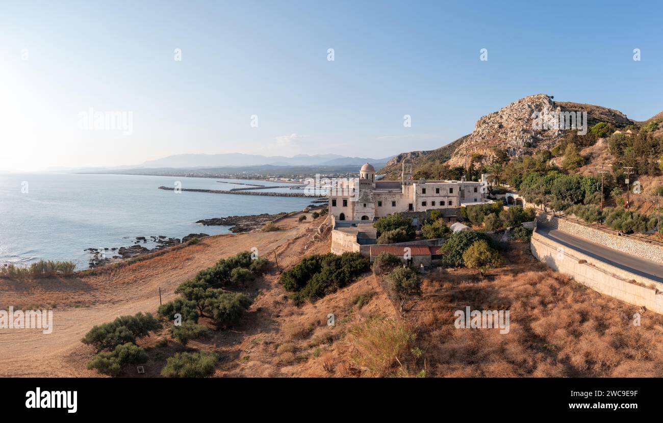 Greece, Monastery Gonia Odigitria, Chania town Crete island. Aerial drone view of Orthodox Church. Calm sea water, blue sky, nature. Stock Photo