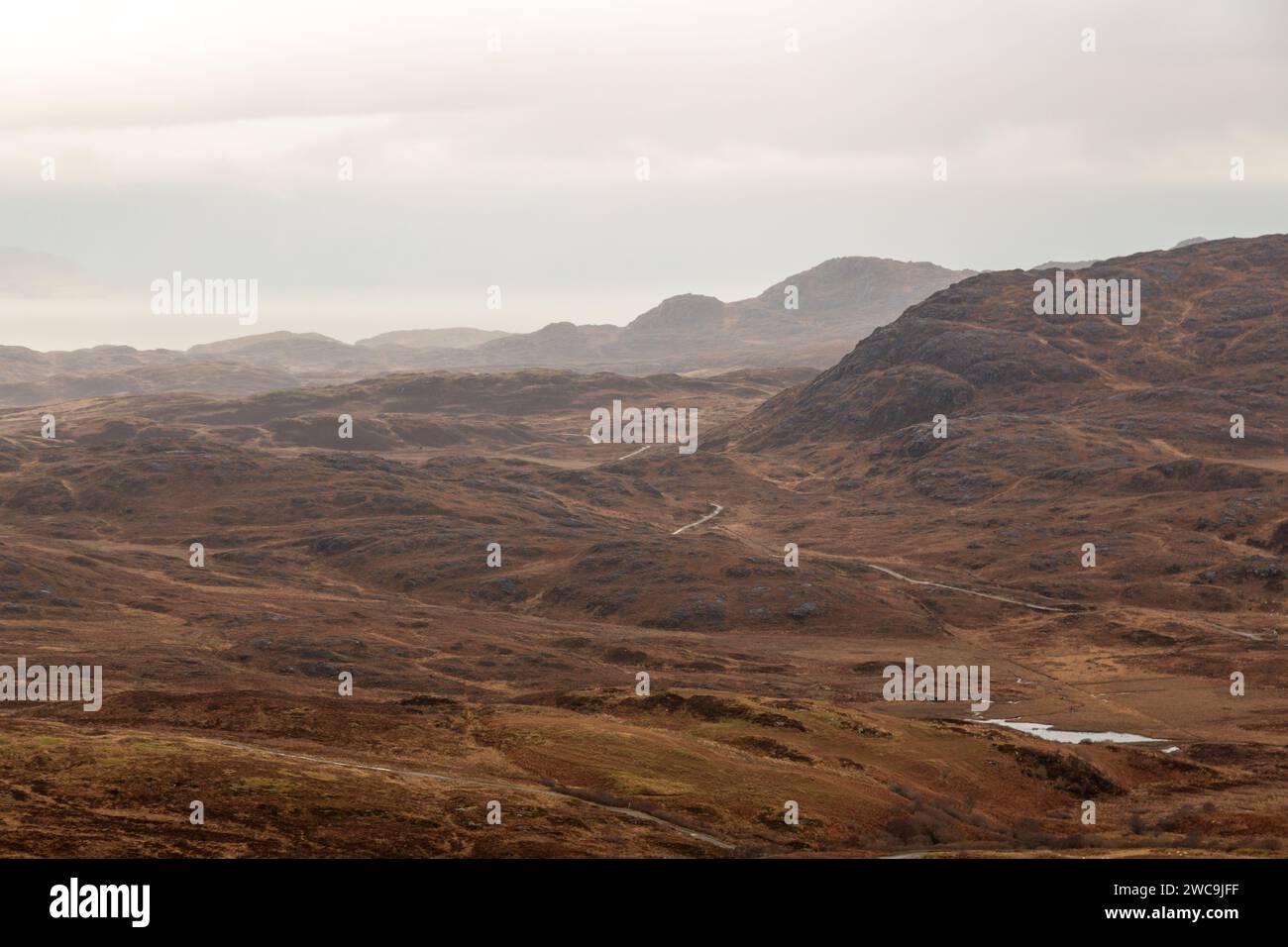 A single track road winding it's way through the volcano crater in the Ardnamurchan Peninsula, Lochaber, Highland, Scotland Stock Photo