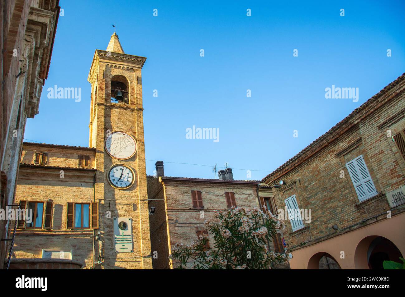 Massignano village, urban lanscape in Italy, Marche, church and old houses Stock Photo