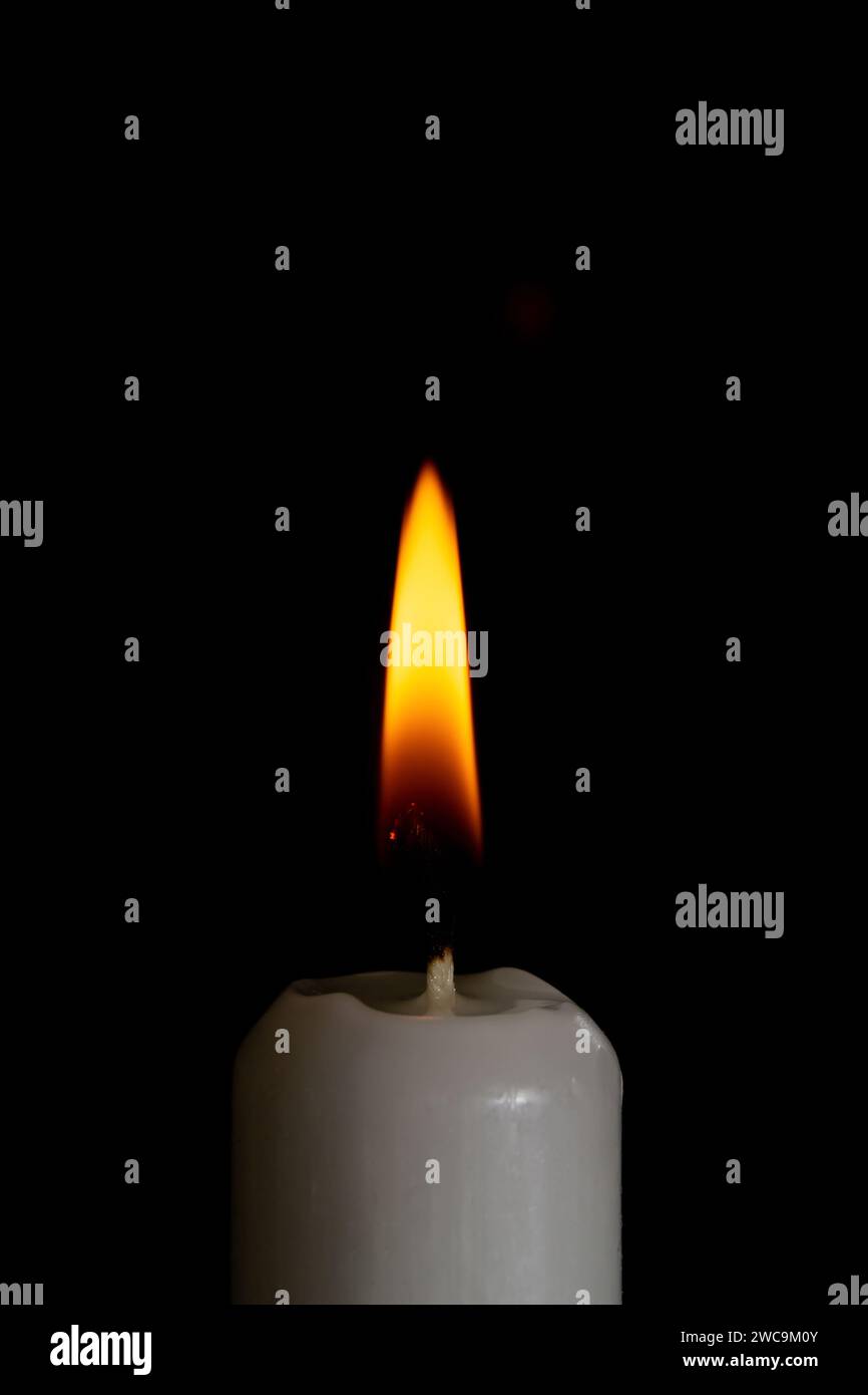 candle on the black background close up Stock Photo - Alamy