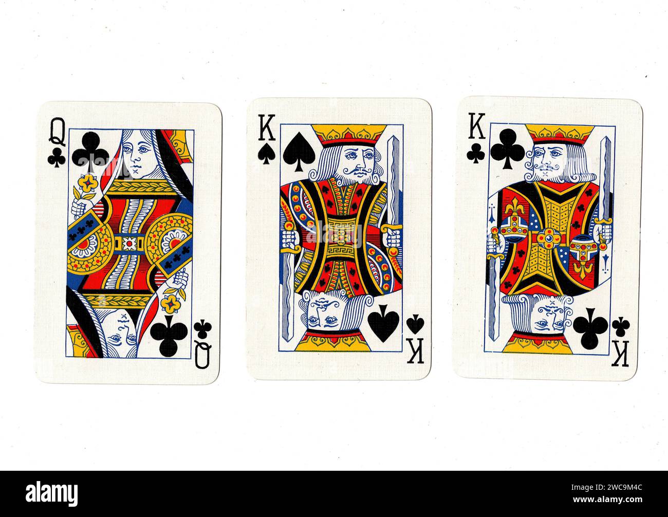 Vintage playing cards showing a pair of black kings and a black queen
