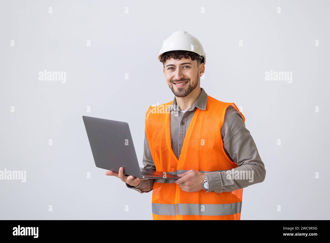 portrait isolated friendly architect with notebook on white background Stock Photo