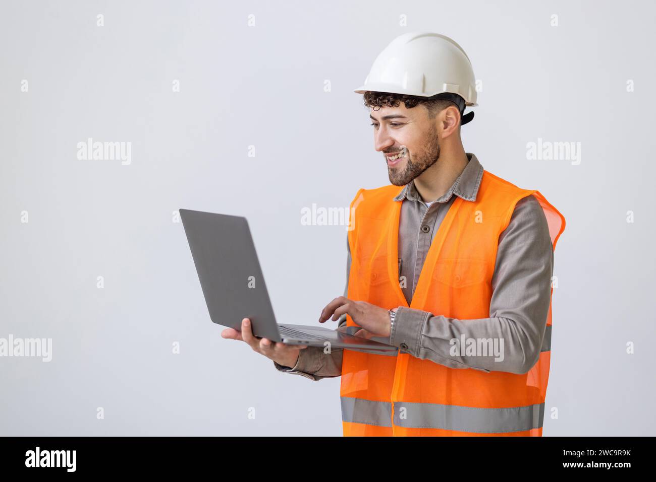 portrait isolated friendly architect with notebook on white background Stock Photo