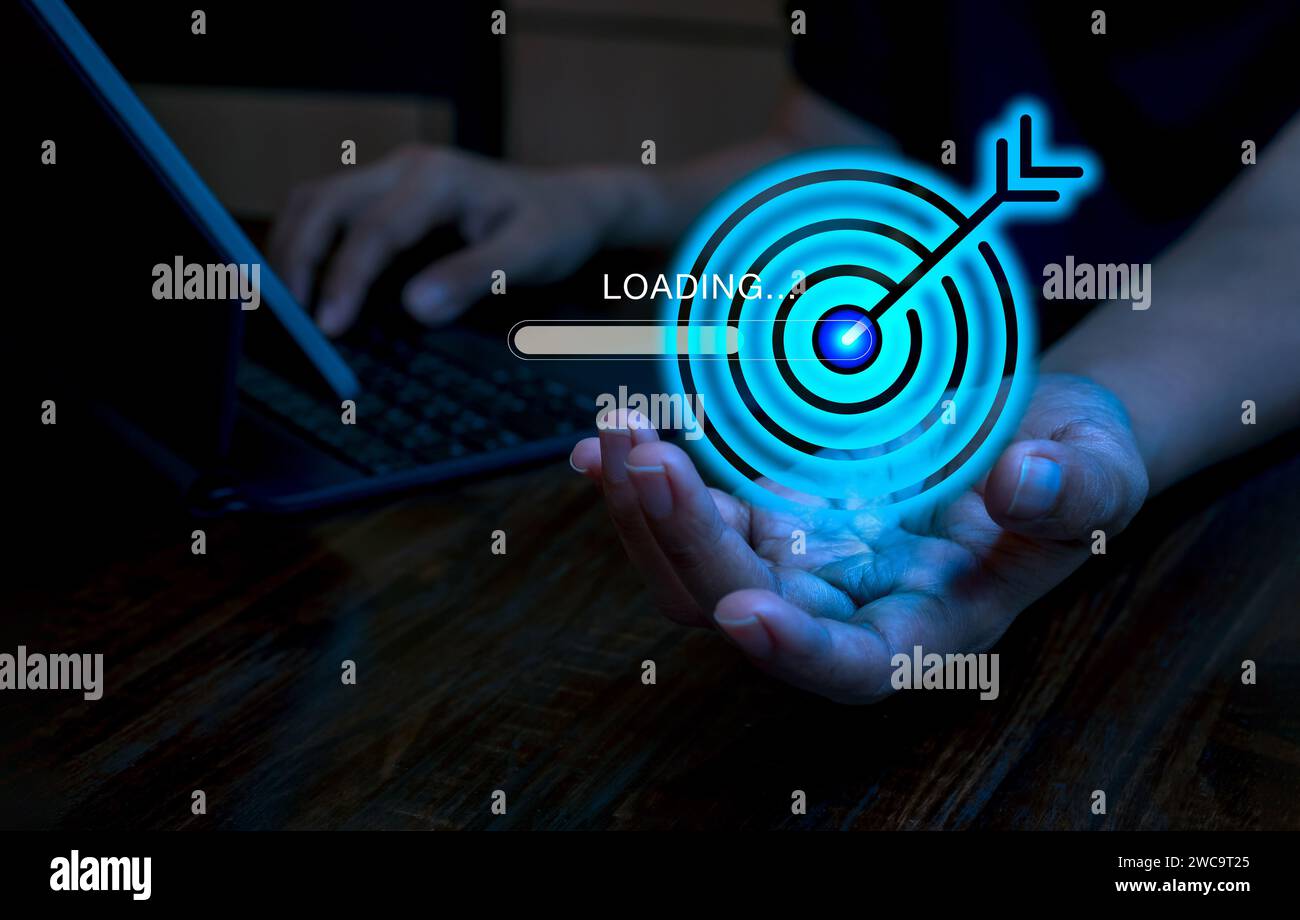 Blue digital goal target dart icon with loading bar in businessman hand ...