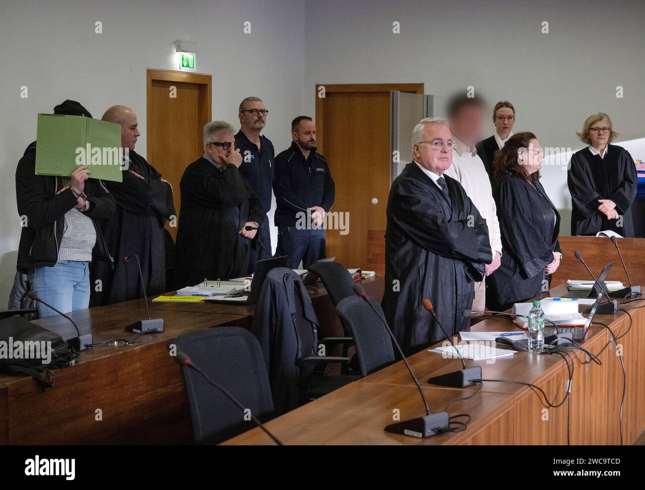 Potsdam, Germany. 15th Jan, 2024. The two defendants (left and 4th from ...