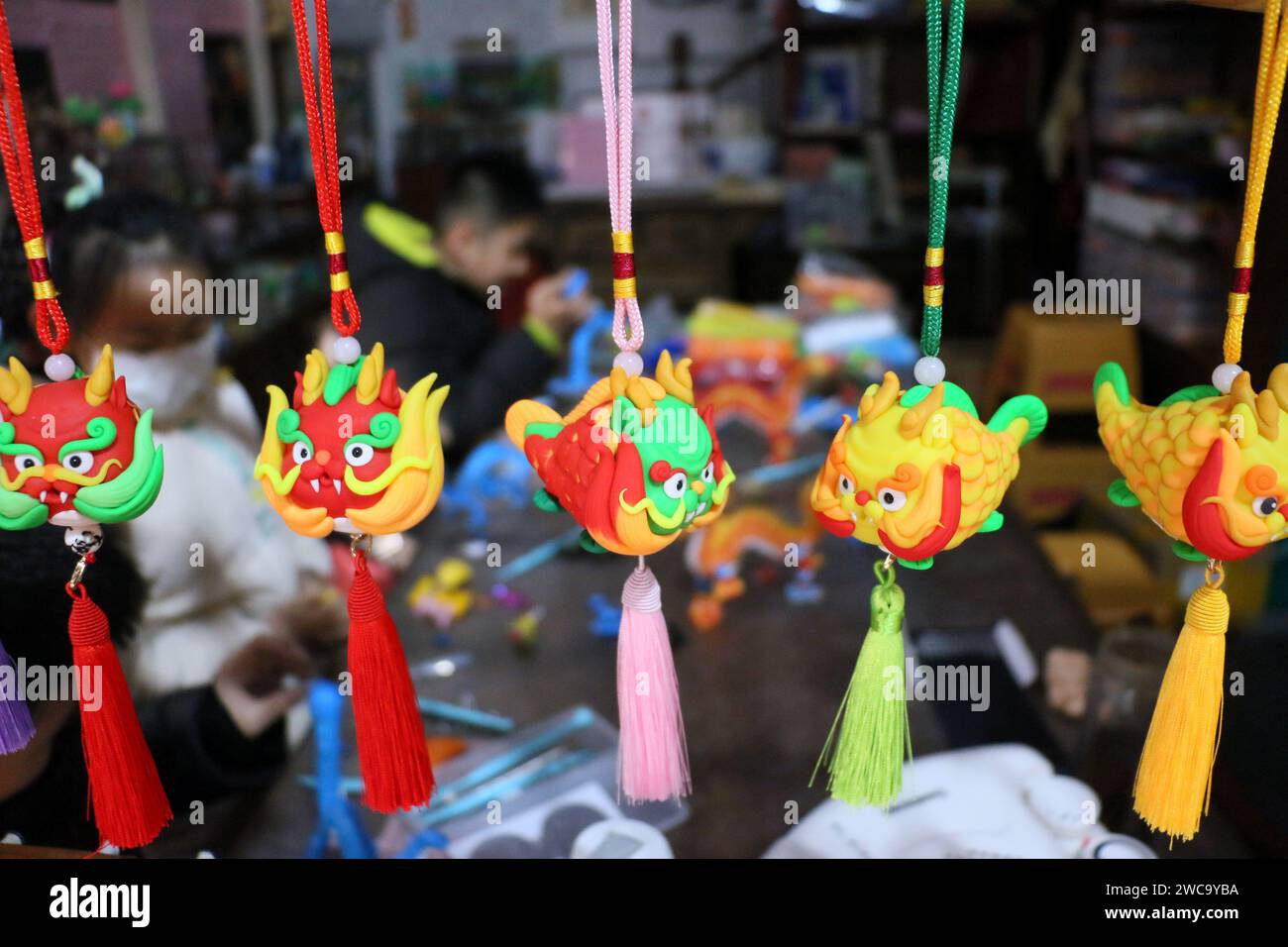 Zoucheng, China. 15th Jan, 2024. Folk dough figurine artist Sun Yandou is kneading a dough figurine dragon series with children in Zoucheng, China, on January 14, 2024. (Photo by Costfoto/NurPhoto) Credit: NurPhoto SRL/Alamy Live News Stock Photo