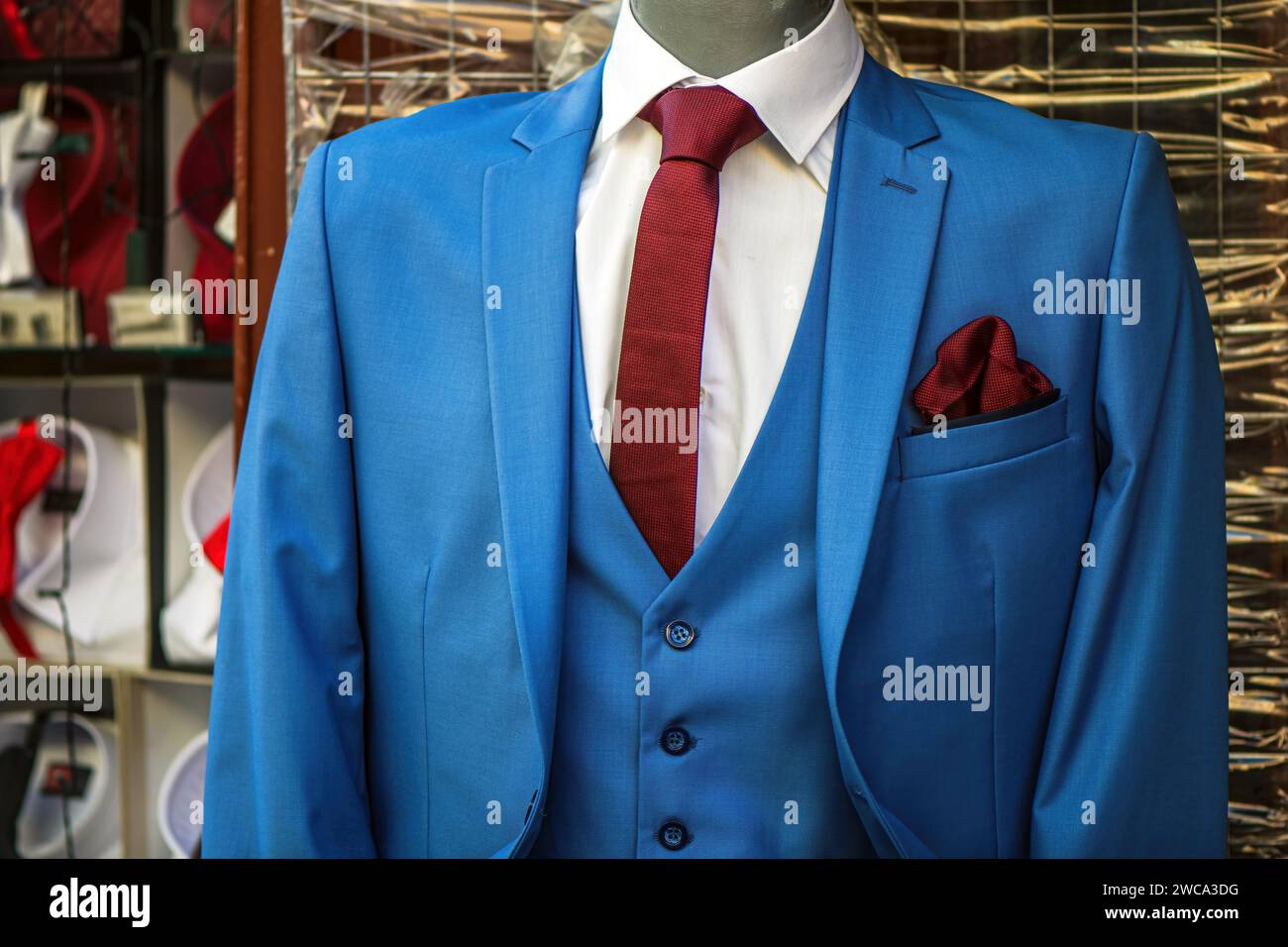 Elegant blue business suit on mannequin in front of the clothing store ...