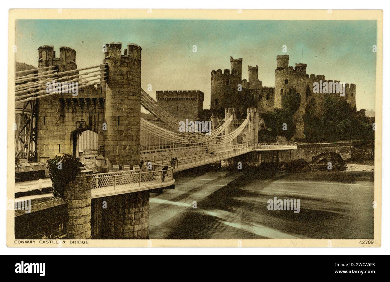 Original Edwardian era postcard of Conwy Castle and bridge, on the North Wales Coast Line, between Crewe and Holyhead, U.K. Circa 1905 / 1910. Stock Photo