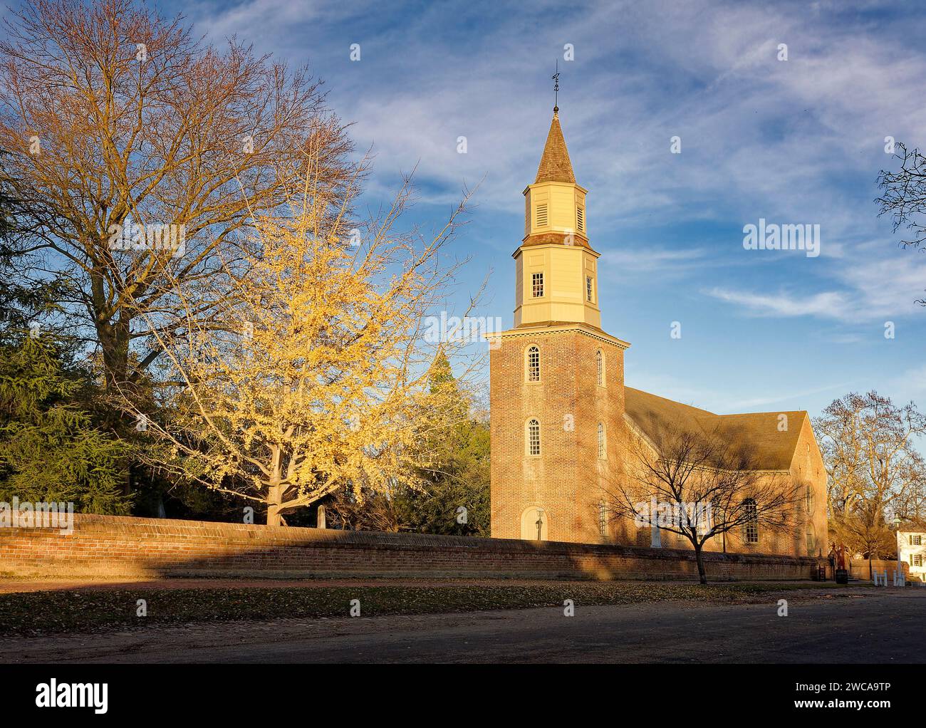 Bruton Parish Church, steeple, brick, wall, trees, religious building, golden hour light, autumn leaves, 1715, colonial, restored 1939, Virginia; Will Stock Photo