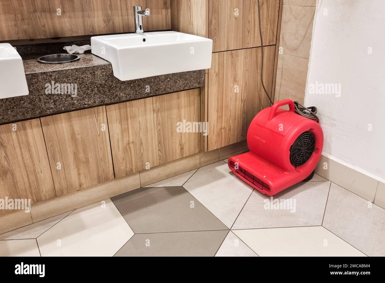 Floor dryer fan used in public washroom and toilet to dry the floor ...
