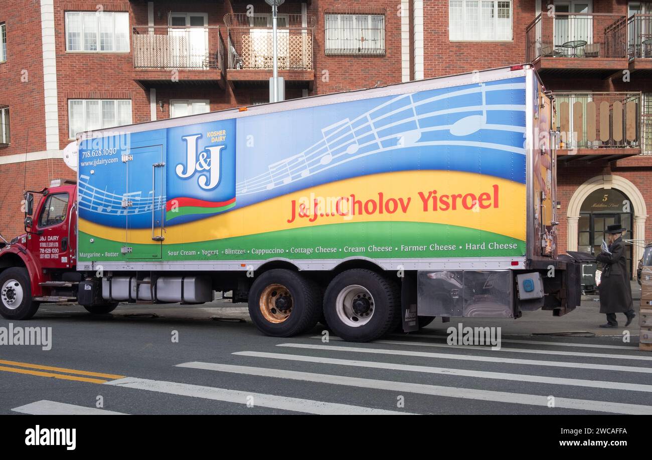 A large truck from J & J Dairy delivering Kosher products to a supermarket in Williamsburg, Brooklyn, New York. Cholo Yisroel is Kosher milk. Stock Photo