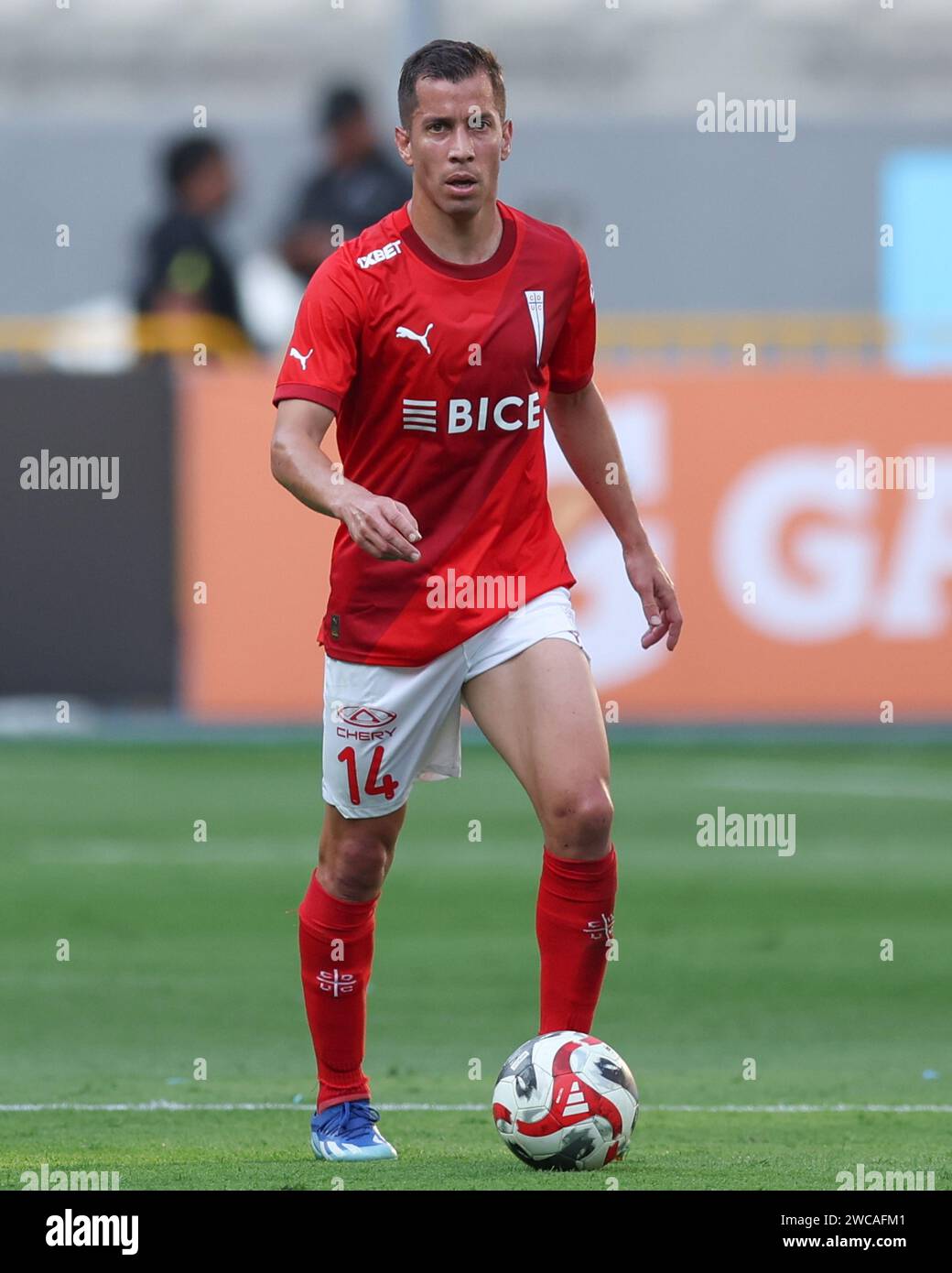 Lima, Peru. 14th Jan, 2024. Agustin Farias of Universidad Catolica during the friendly match between Sporting Cristal and Universidad Catolica de Chile played at Nacional Stadium on January 14, 2024 in Lima, Peru. (Photo by Miguel Marrufo/PRESSINPHOTO) Credit: PRESSINPHOTO SPORTS AGENCY/Alamy Live News Stock Photo