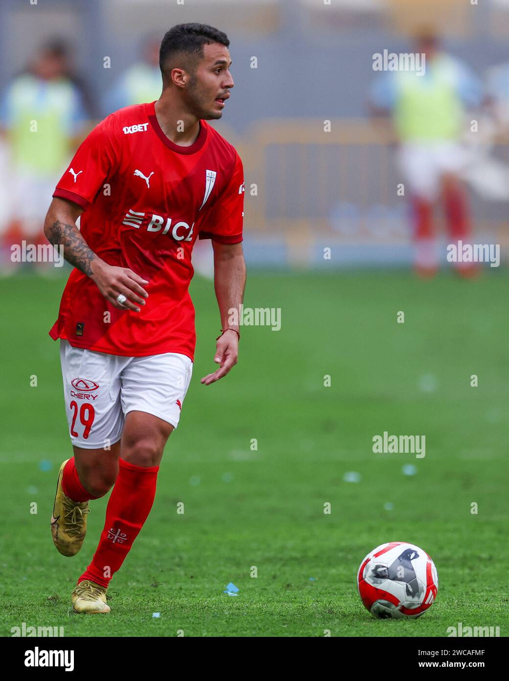 Lima, Peru. 14th Jan, 2024. Aaron Astudillo of Universidad Catolica during the friendly match between Sporting Cristal and Universidad Catolica de Chile played at Nacional Stadium on January 14, 2024 in Lima, Peru. (Photo by Miguel Marrufo/PRESSINPHOTO) Credit: PRESSINPHOTO SPORTS AGENCY/Alamy Live News Stock Photo