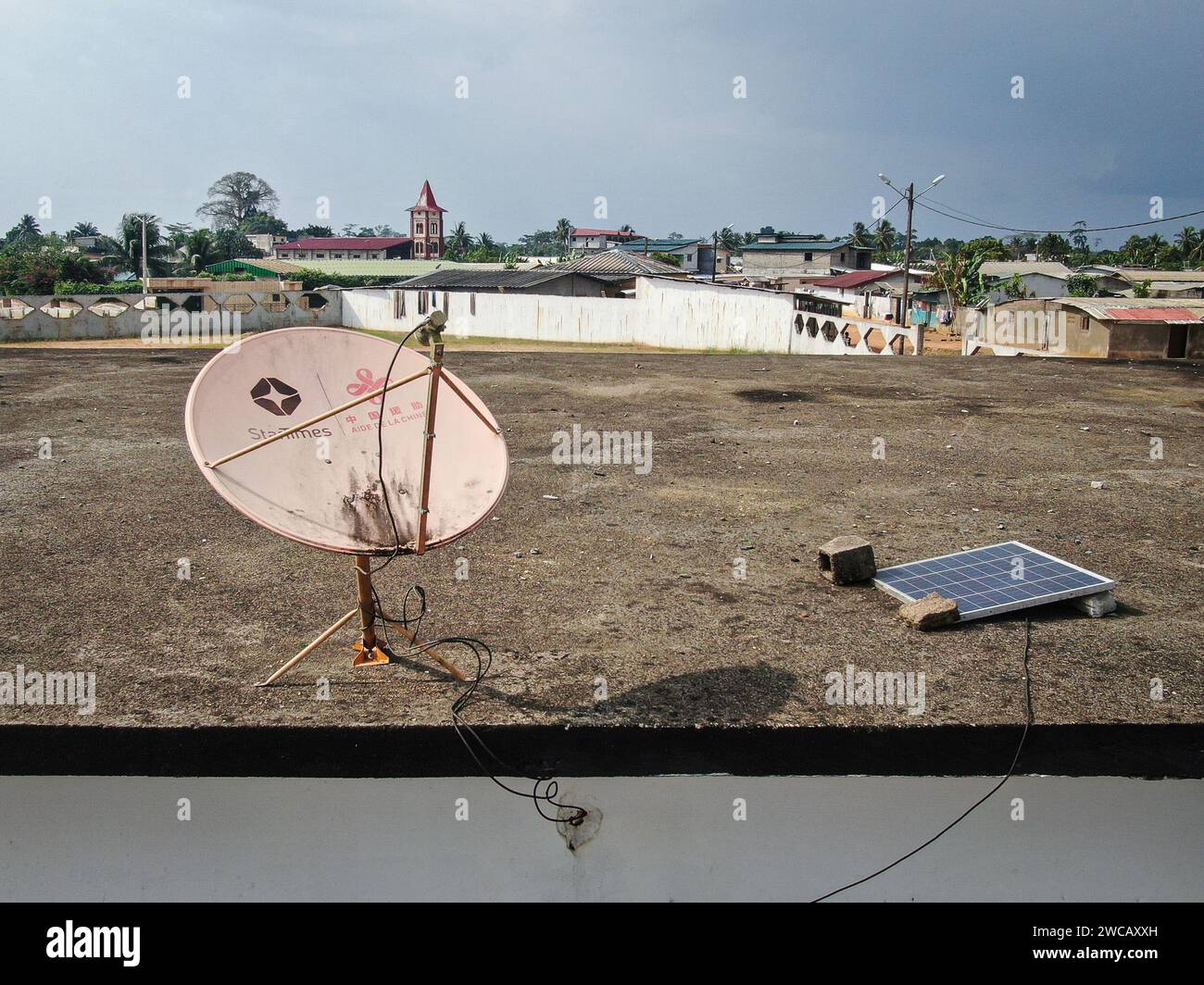 (240115) -- ABIDJAN, Jan. 15, 2024 (Xinhua) -- A drone photo taken on Jan. 14, 2024 shows a satellite TV receiver in Yaou village, Cote d'Ivoire. Thousands of people living in remote areas in Cote d'Ivoire and other African countries were able to watch the matches at home when the 2023 Africa Cup of Nations (AFCON) kicked off on Saturday, thanks to broadcast services provided by StarTimes, a Chinese digital TV operator. A project aiming to connect 10,000 African villages to satellite television services was proposed during the Forum on China-Africa Cooperation (FOCAC) summit in Johannesbur Stock Photo