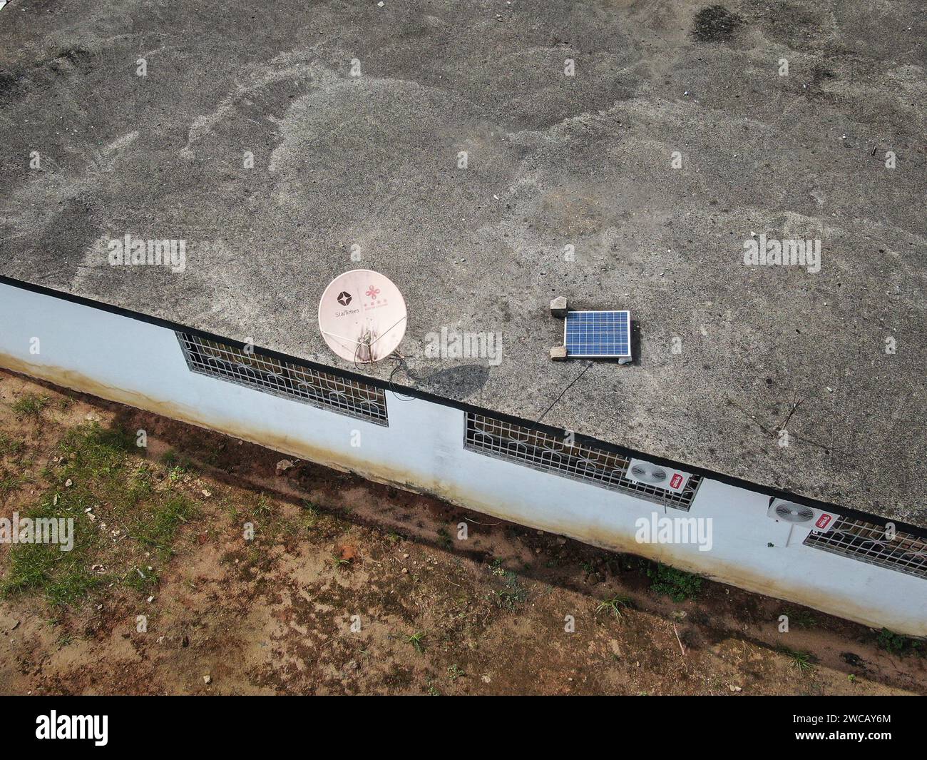 (240115) -- ABIDJAN, Jan. 15, 2024 (Xinhua) -- An aerial drone photo taken on Jan. 14, 2024 shows a satellite TV receiver in Yaou village, Cote d'Ivoire. Thousands of people living in remote areas in Cote d'Ivoire and other African countries were able to watch the matches at home when the 2023 Africa Cup of Nations (AFCON) kicked off on Saturday, thanks to broadcast services provided by StarTimes, a Chinese digital TV operator.   A project aiming to connect 10,000 African villages to satellite television services was proposed during the Forum on China-Africa Cooperation (FOCAC) summit in Johan Stock Photo