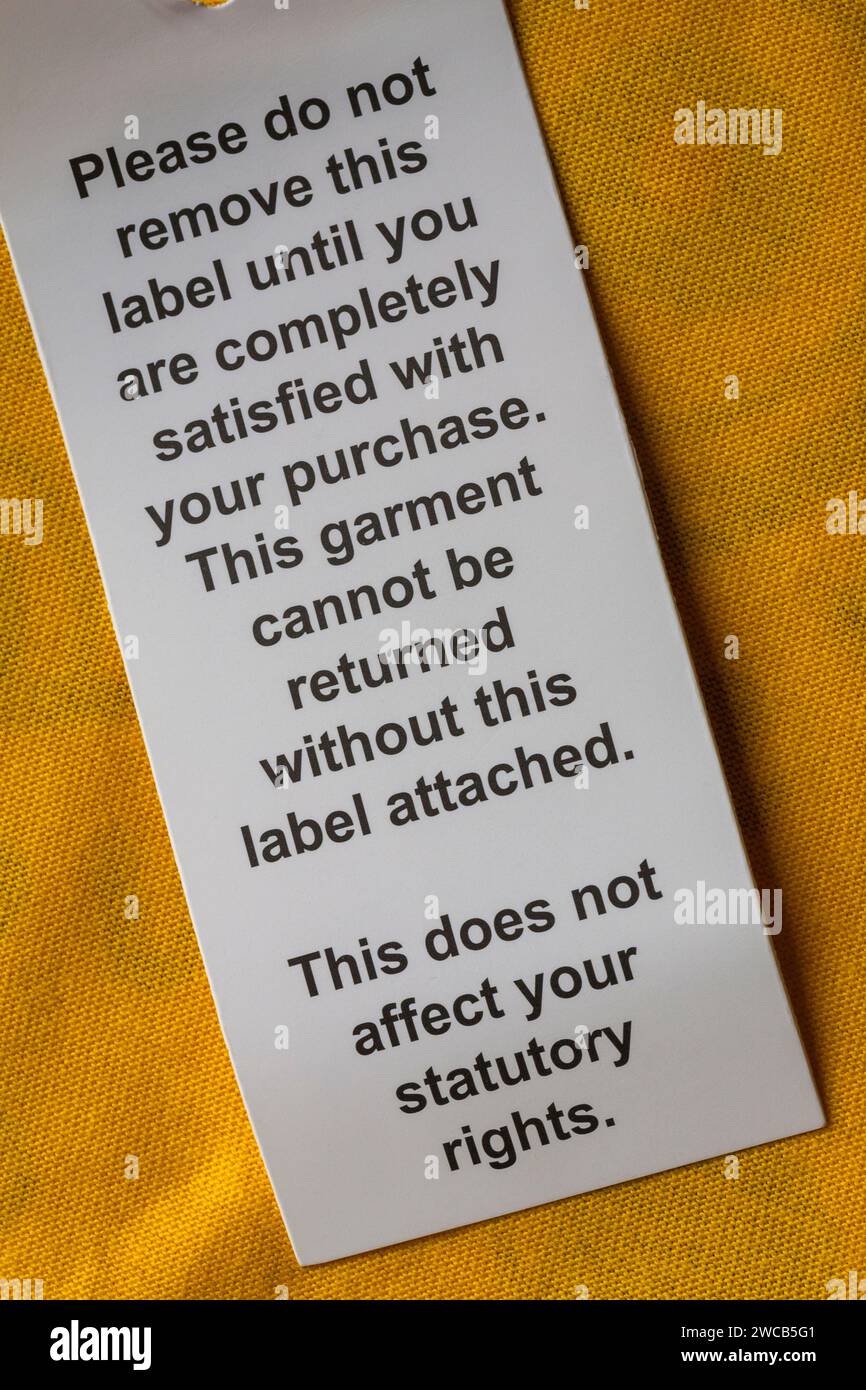 please do not remove this label until you are completely satisfied with your purchase label on BBC Children in Need Pudsey t-shirt Stock Photo