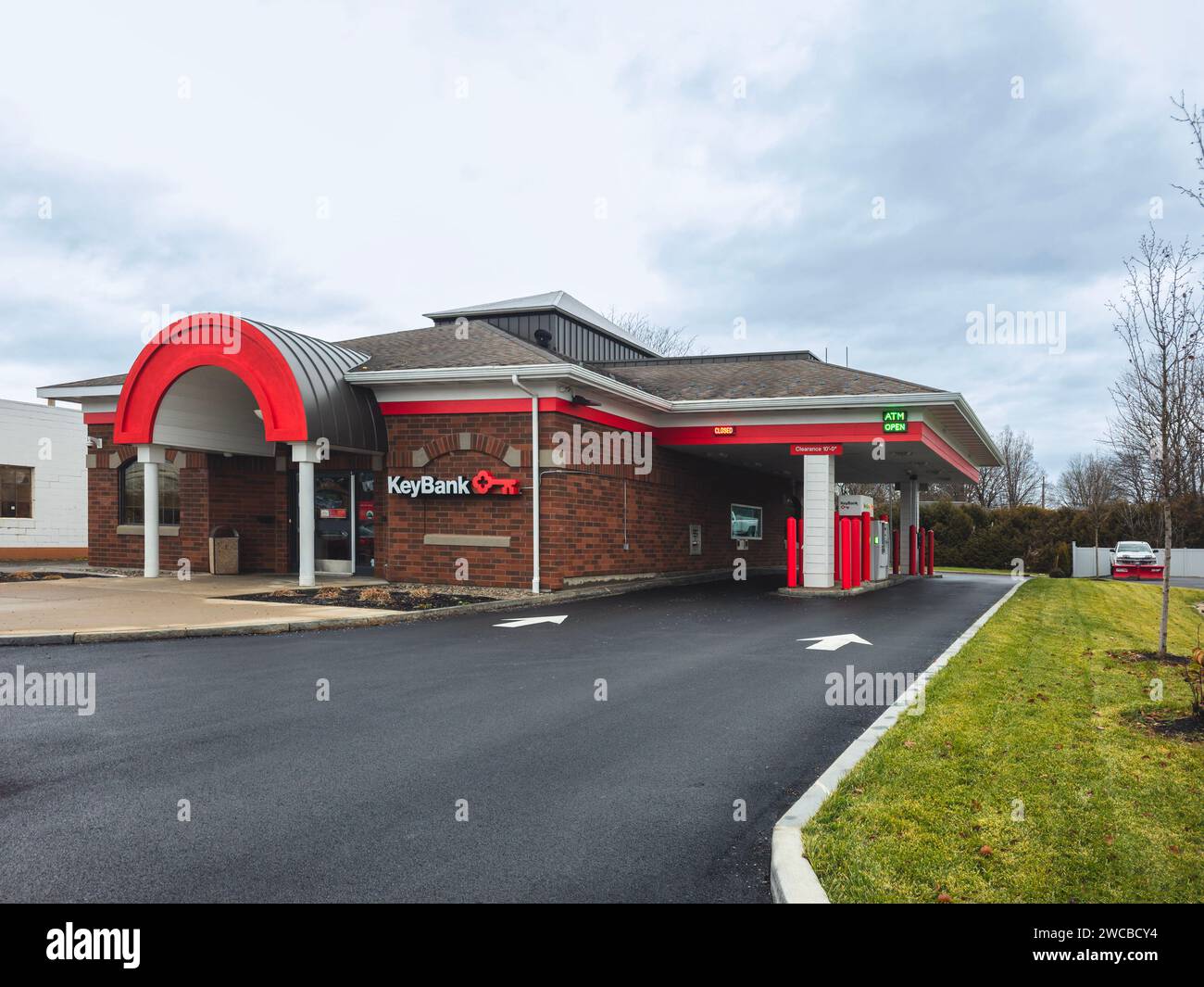 Rome, NY - Dec 17, 2023: A KeyBank branch with a drive-thru ATM. It is a regional bank serving residents in 15 states where it maintains branches with Stock Photo
