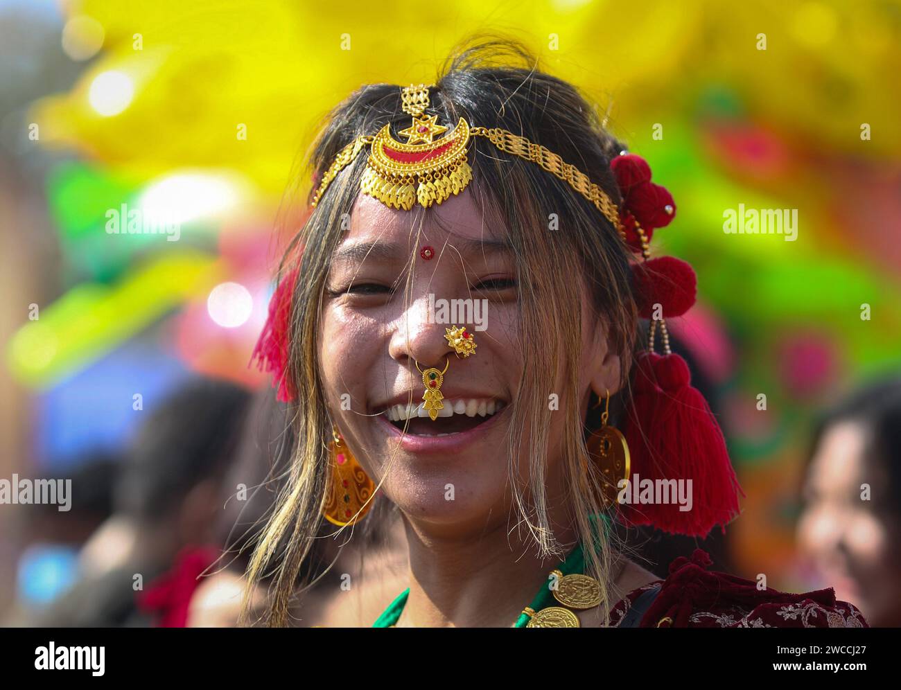 Kathmandu, Bagmati, Nepal. 15th Jan, 2024. A woman from Magar community smiles participating in celebrations of Maghe Sankranti Festival that marks the beginning of the warmer season in Kathmandu, Nepal. (Credit Image: © Sunil Sharma/ZUMA Press Wire) EDITORIAL USAGE ONLY! Not for Commercial USAGE! Stock Photo