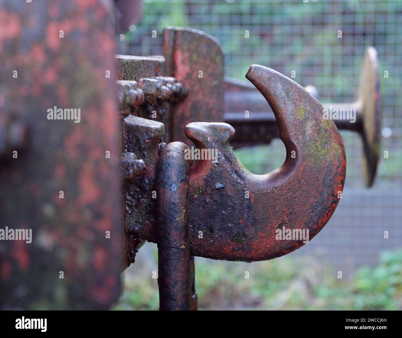Iron hook and chain and buffer on a railway wagon in Bristol UK part of the buffer and chain coupling system of linking carriages Stock Photo