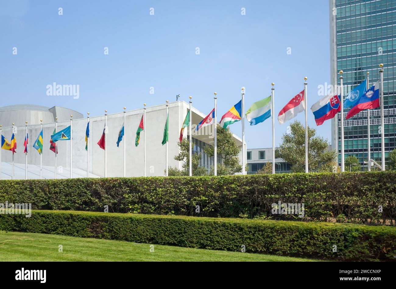 New York City, NY, USA - September 1, 2015: UN United Nations general assembly building with world flags flying in front, Slovenian flag first in a ro Stock Photo