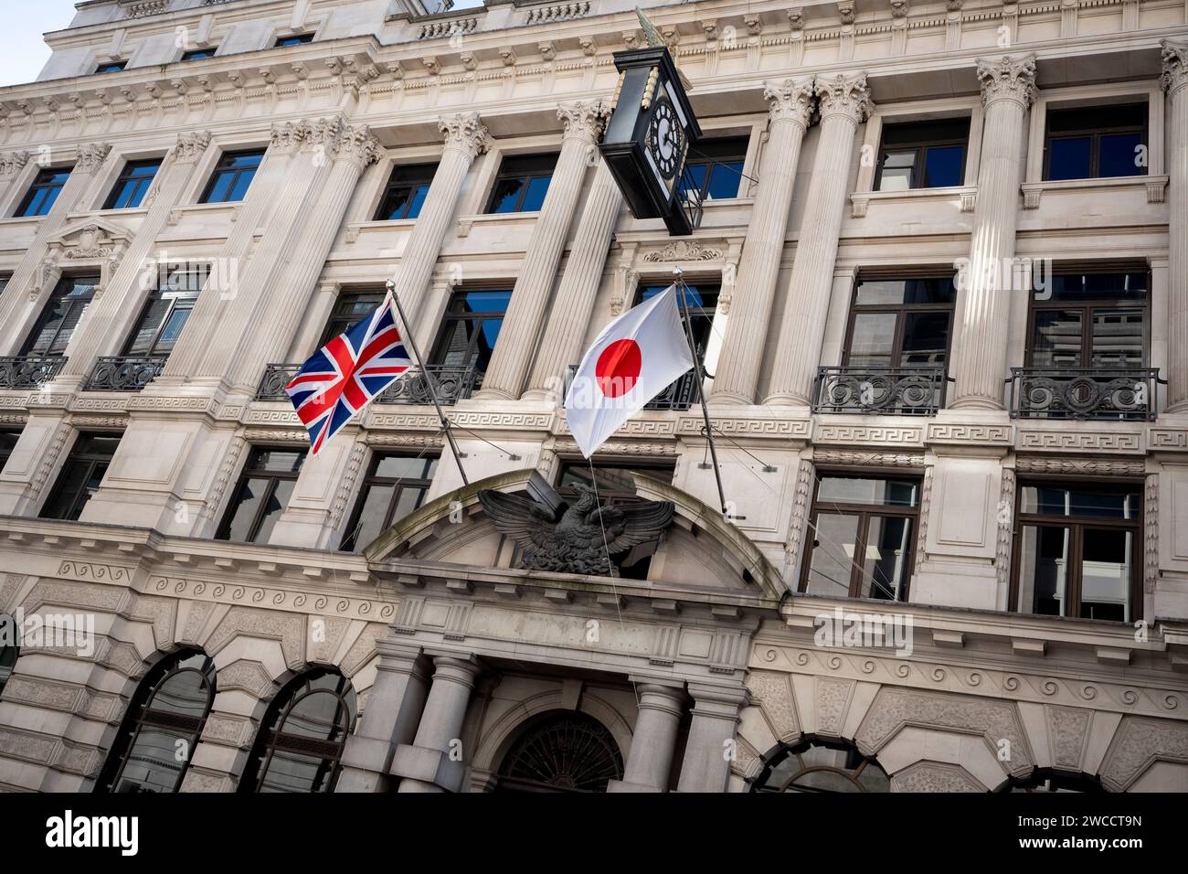 The British 'Union Jack' and Japanese 'Hinomaru' (aka the 'Nisshoki') flags hang together outside a financial institution in the City of London, the capital's financial district, on 15th January 2024, in London, England. Stock Photo