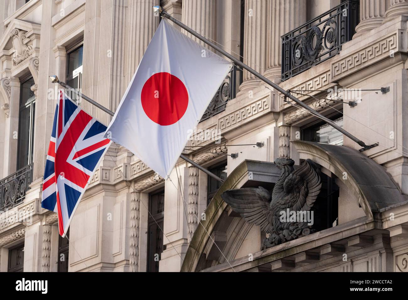 The British 'Union Jack' and Japanese 'Hinomaru' (aka the 'Nisshoki') flags hang together outside a financial institution in the City of London, the capital's financial district, on 15th January 2024, in London, England. Stock Photo